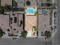 A birds eye view of the property including a refreshing swimming pool and cozy backyard patio at 9074 Iron Cactus Ave, Las Vegas, NV 89148
