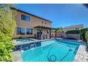 An inviting private pool and spa provide a tranquil retreat in the backyard at 9542 Ridgeglen Ct, Las Vegas, NV 89148