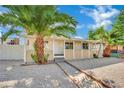 Welcoming single-story home with a simple, clean gravel front yard and lush palms at 101 N 19Th St, Las Vegas, NV 89101