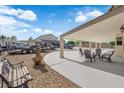 Inviting covered patio with ample seating perfect for outdoor relaxation and entertaining featuring a low-maintenance yard at 1919 Belcastro St, Las Vegas, NV 89117