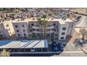 Aerial view showcasing a well-maintained condo community with carports and desert landscaping at 2068 Mesquite Ln # 203, Laughlin, NV 89029