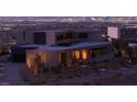Modern home exterior showing a rooftop, elegant design, and city views at 21 Rockstream Dr, Henderson, NV 89012