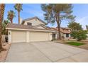 Charming two-story home with a three car garage and desert landscaping at 2344 Valleywood St, Henderson, NV 89014