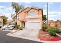 Inviting two-story home with a two-car garage, ample parking, and neat landscaping at 2354 Buffalo Run Ave, Las Vegas, NV 89123