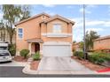 Charming two-story home with a two-car garage, tidy landscaping and a welcoming entrance at 2354 Buffalo Run Ave, Las Vegas, NV 89123