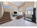 Inviting living room featuring high ceilings, abundant natural light, and a seamless flow into the entry at 2637 Ohio Ct, Las Vegas, NV 89128