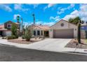 Charming single-story home with desert landscaping, tile roof, and a two-car garage at 2860 Misty Ct, Henderson, NV 89074