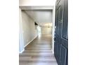 Spacious entryway with wood-look flooring and open floor plan leading to the living area at 3221 Villa Pisani Ct, North Las Vegas, NV 89031