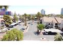 A condo complex featuring mature landscaping and covered parking at 3606 Di Salvo Dr # 133, Las Vegas, NV 89103