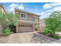 Charming two-story home with a large two-car garage and lovely desert landscaping at 5234 Tulip Hill Ave, Las Vegas, NV 89141
