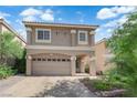 Inviting two-story home with a two-car garage and well-maintained desert landscaping at 5234 Tulip Hill Ave, Las Vegas, NV 89141
