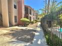 Community exterior showcasing lush landscaping, walkways, and privacy fences, offering a serene neighborhood ambiance at 5576 W Rochelle Ave # 27A, Las Vegas, NV 89103