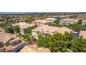 Eye-level aerial shot of a townhome with fresh landscaping, large windows, and a red-tiled roof at 5855 Valley Dr # 2106, North Las Vegas, NV 89031