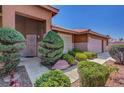 Charming home exterior featuring well-manicured landscaping and a welcoming entrance at 5933 Perfect View St, Las Vegas, NV 89130