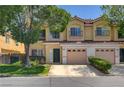 Charming two-story townhome with a private balcony, attached garage, and well-maintained lawn at 6533 Sundown Heights Ave, Las Vegas, NV 89130