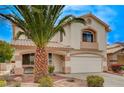 Inviting two-story home with a well-manicured front yard and attached two-car garage at 775 Wigan Pier Dr, Henderson, NV 89002