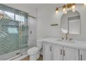 Stylish bathroom featuring quartz countertops, modern fixtures, and a glass-enclosed shower at 8416 Kawala Dr, Las Vegas, NV 89128