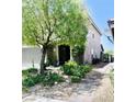A charming side yard showcases lush landscaping and a paved walkway leading to the home's entrance at , Las Vegas, NV 89141