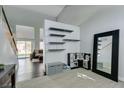 Open entryway with high ceilings, modern shelving, and a view into the living area at 1013 Corsica Ln, Las Vegas, NV 89144