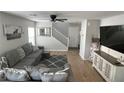 Spacious living room featuring modern decor, grey couches and plenty of natural light at 10331 Ednor St, Las Vegas, NV 89183