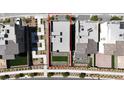 Overhead view of a modern home with neatly landscaped backyard, surrounded by similar residential properties at 11658 Midnight Melody Ave, Las Vegas, NV 89138
