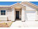 Charming single story home featuring a tile roof, two car garage and well manicured landscaping at 1709 High Breeze Ct, Las Vegas, NV 89106