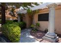 Welcoming entrance with shaded walkway, beautiful shrubbery, and decorative pillar at 2851 S Valley View Blvd # 1130, Las Vegas, NV 89102