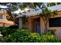 Inviting front entrance with a pergola, stylish columns, and lush landscaping at 2851 S Valley View Blvd # 1130, Las Vegas, NV 89102