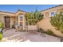 Inviting front patio with brick paving, a swing, and cozy decor at 3709 Corte Bella Hills Ave, North Las Vegas, NV 89081