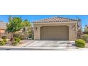 Charming single-story home featuring a two-car garage and desert landscaping at 3709 Corte Bella Hills Ave, North Las Vegas, NV 89081
