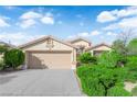 Beautiful single-story home featuring a two-car garage and mature landscaping at 412 Carlton Kay Pl, Las Vegas, NV 89144