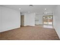 Open-concept living room with a seamless flow to the kitchen and gleaming hardwood floors at 4829 Hot Springs Ave, Las Vegas, NV 89110