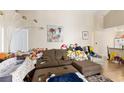 Comfortable living room with wood-look floors and an open layout that flows into the kitchen at 5052 S Rainbow Blvd # 201, Las Vegas, NV 89118