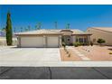Exterior of a single-story home with three-car garage, desert landscaping, and tile roof at 6100 Cocktail Dr, Las Vegas, NV 89130
