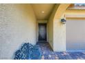 Inviting entryway with tiled floor, security door, and sitting bench at 7224 Piute Mesa St, North Las Vegas, NV 89084