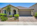 Charming single-story home features a tile roof and a well-maintained front yard at 7224 Piute Mesa St, North Las Vegas, NV 89084