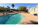 Captivating backyard pool showcasing a uniquely shaped pool with a spacious, bright patio at 821 Star Pine Dr, Las Vegas, NV 89144
