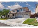 Charming two-story home with a three-car garage and desert-friendly landscaping at 9709 Casper Peak Ct, Las Vegas, NV 89117