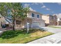 Two-story home with a three-car garage, cozy porch bench, and desert landscaping at 9709 Casper Peak Ct, Las Vegas, NV 89117