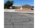 Cozy single-story home featuring an attached two-car garage, neutral paint and low maintenance landscaping at 1809 Lamplighter Ln, Las Vegas, NV 89104