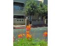 Well maintained building exterior with mature landscaping and flowers at 1908 Tierra Vista Dr # 210, Las Vegas, NV 89128