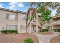 Charming condo building with stucco exterior, lush landscaping, and inviting entrance at 3182 Tarpon Dr # 204, Las Vegas, NV 89120