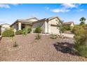 Charming single-story home featuring a two-car garage and low maintenance desert landscaping at 3257 Rushing Waters Pl, Las Vegas, NV 89135