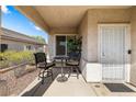 Inviting front porch with seating, providing a welcoming entrance to the home at 3257 Rushing Waters Pl, Las Vegas, NV 89135