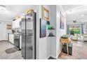 Bright kitchen featuring stainless appliances and view into the backyard at 3499 Middlebury Ave, Las Vegas, NV 89121