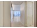 Bright hallway featuring white tiled floors and a glimpse of the city view from the living area at 3726 S Las Vegas Blvd # 1003, Las Vegas, NV 89158