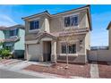 Attractive two-story home featuring a neutral color palette and easy-to-maintain landscaping at 5200 Paradise Skies Ave, Las Vegas, NV 89156