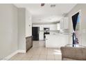 Bright kitchen featuring white cabinets, stainless steel appliances, and ample counter space at 5200 Paradise Skies Ave, Las Vegas, NV 89156