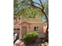Two-story home featuring a welcoming entrance, a well-maintained lawn, and an attached garage at 8355 Pearl Beach Ct, Las Vegas, NV 89139
