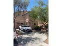 Exterior view featuring a wide drive way, neutral paint and low maintenance landscaping at 8355 Pearl Beach Ct, Las Vegas, NV 89139